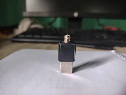 Small compact black USB adapter with threaded metal antenna connector attac.. 스톡 사진