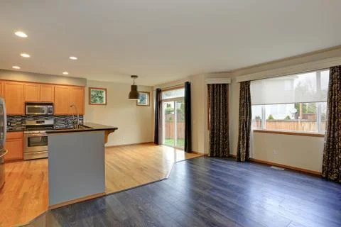 Small compact kitchen room and dining area with hardwood floor. Stock Photos