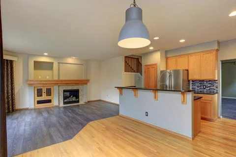 Small compact kitchen room with light wood cabinetry, Quartz counters and din Stock Photos