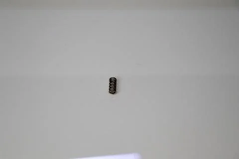 Small Compression Spring Isolated on White Background Stock-Fotos