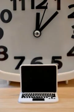 Small computer with clock, screen time concept Фото