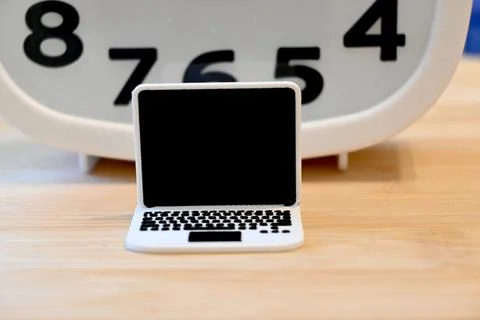 Small computer with clock, screen time concept Stockfoto's