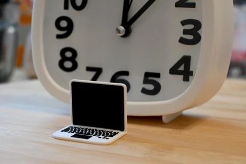 Small computer with clock, screen time concept Foto stock