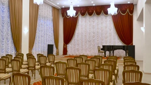 A small concert hall in a classical setting with a piano on stage. Stock Footage 146349834