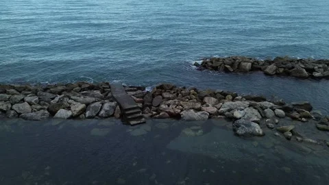 Small concrete ladder on a cliff by drone Stock Footage 288488305