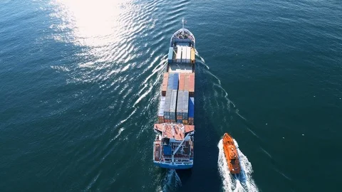 Small Container Cargo Ship Followed by Tug Boat, Aerial View Stock Footage 91131150