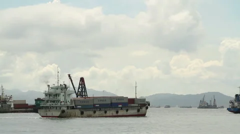 Small container ship crossing the habour Stock Footage 66439589
