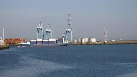 Small container ship entering port Видео 219347018