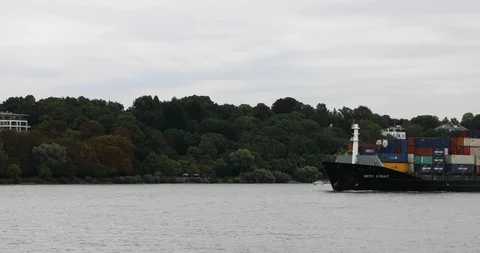Small Container ship leaving Hamburg Stockbeeldmateriaal 95720703
