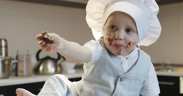 A small cook smeared in chocolate. Stock Footage 85817645