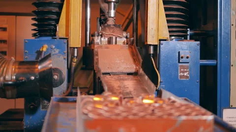 Small copper elements are getting released by a factory machine Stock Footage 156902589