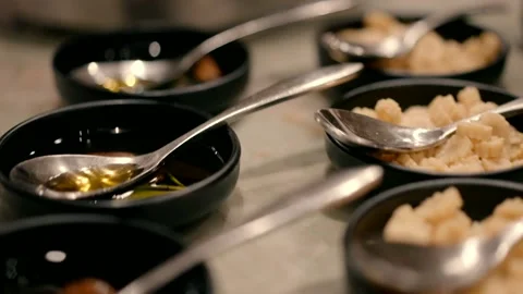 Small corn cooked in saucers at an event hall buffet Video stock 226609561