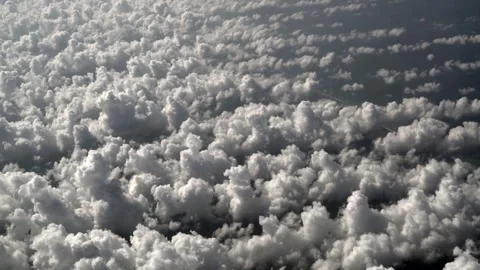 Small cotton clouds seen from plane window - High Altitude and Vapor Formations Stock Footage 339726166