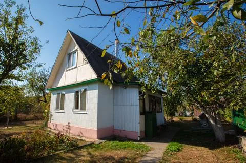 Small country house with a plot. Typical houses given in the post-Soviet spac Fotos Stock