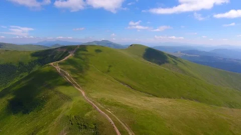 Small country road on mountains range. aerial view Stock Footage 79071656