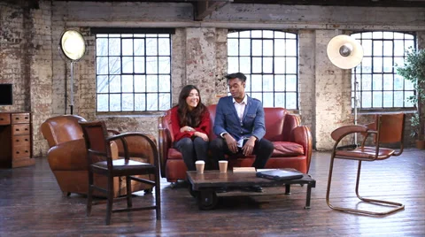 Small creative team gathering discussing a project in shabby chic business Vídeo Stock 32727694