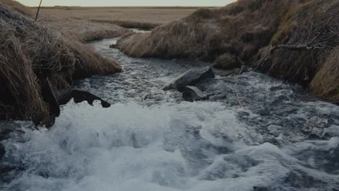 A small creek close to the waterfall in the winter of Iceland Stock Footage 106194824