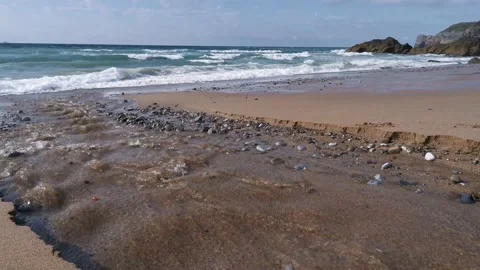 Small creek with water going down on the beach Stock Footage 131837517