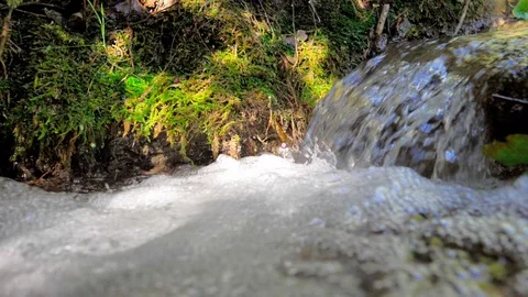 Small creek waterfall with slow motion foam Stock Footage 124367146