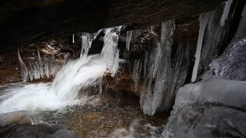 Small creek winter waterfall Stock Footage 99445180