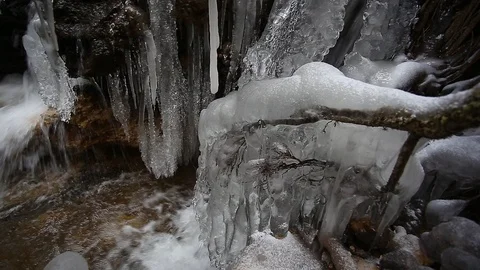 Small creek winter waterfall icicles Stock Footage 99445154