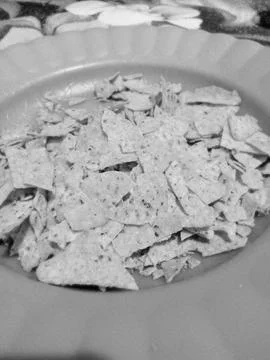 Small crispy crisps snacks in black and white 스톡 사진