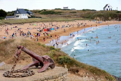 Small crowded beach by the ocean Stock Photos