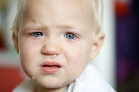 Small, crying toddler after a temper tantrum Stock Photos