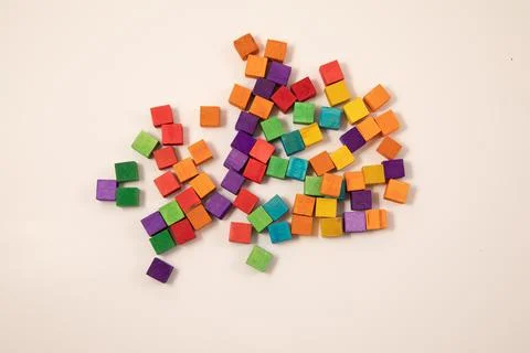 Small cubes in different colors on a white background using in classroom for Stock Photos