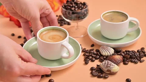 Small Cup Espresso coffee in hand. Aromatic Italian coffee with beautiful crema. Video stock 148724673