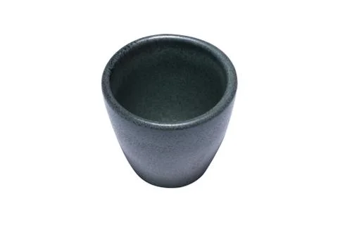 The small cup is gray-black, it is made of stone and has a beautiful texture Stock Photos