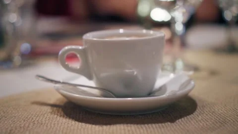 Small cup of hot coffe in a cozy restaurant, hot drink cinematic video Stock Footage 263930264