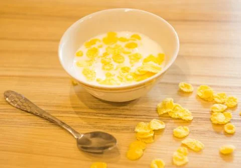 A small Cup of milk with grains is on the table Stock Photos
