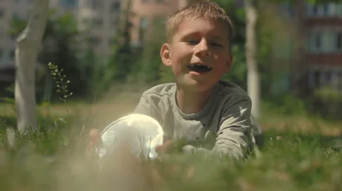 Small, cute boy 6 years makes sunbeams. slow-motion Stock Footage 37692593