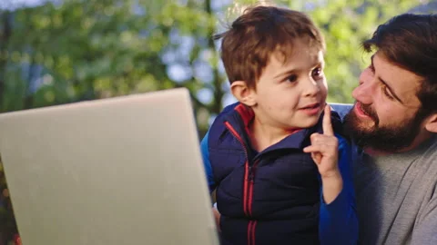 Small cute boy and his big brother have a fun time together they make good Stock Footage 135667474