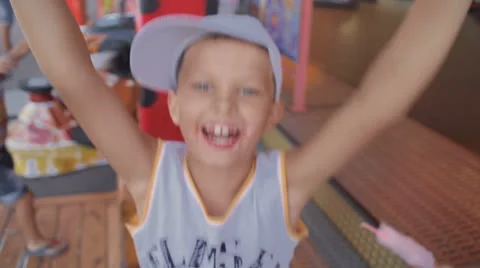 Small, cute boy jumping for joy and laughter Stock Footage 25857212