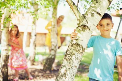 Small cute boy posing with rest of family in the background Stock Photos