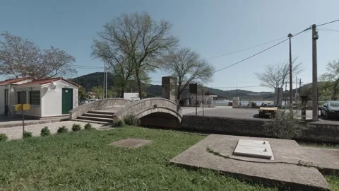 Small cute bridge over canal with salt ponds in the back in Ston, Croatia Stock Footage 242863984