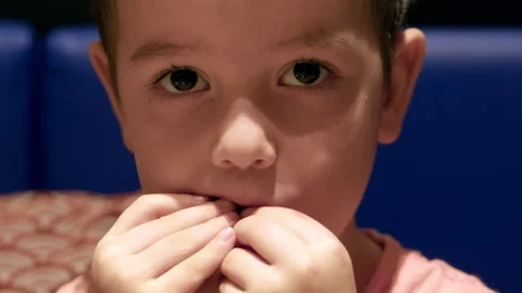 Small Cute Child Sits at the Table and Eats Exotic Fruit, the Baby Eats Stock Footage 168143737
