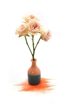 Small cute tiny vase with dry tea rose bouquet and hand painted watercolor blot Stock Photos