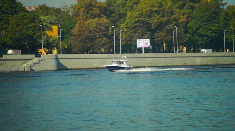 Small cutter passing fast by Neva river granite quay  at sunny day. Stock Footage 36489745