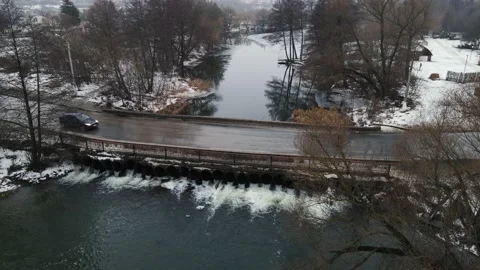 Small dam with a carriageway on it Vídeo Stock 147510666