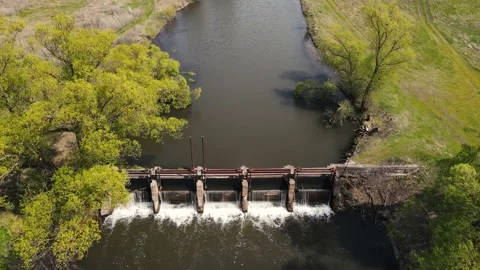 Small dam by the river in the field. 4k drone footage Stock Footage 168202318