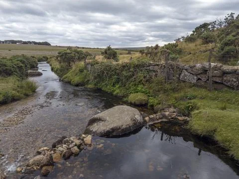 Small dam of rocks across a stream Stock Photos