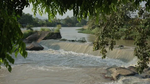 Small dam with water flowing rapids Stock Footage 208252661