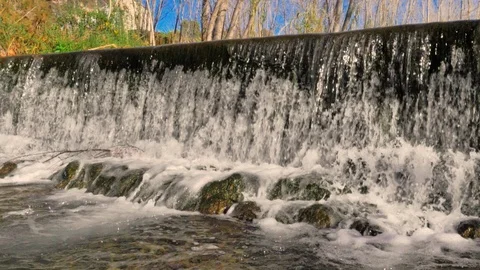 Small dam waterfall with waterfall in slow motion Stock Footage 124390416