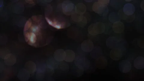 Small dark abstract lights overlaid with large bokeh lights Vidéo 319955688