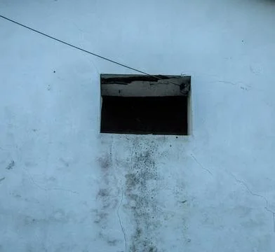 Small, dark window Stock Photos