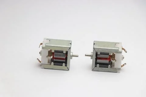 Small dc motor with open frame and its rotor part visible Stock Photos