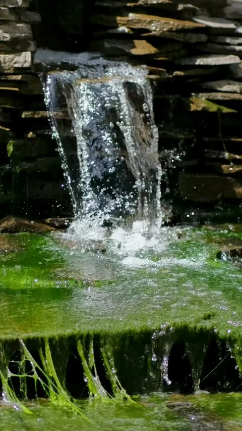 A small decorative waterfall in the Park . Landscape design. Stock Footage 285485073
